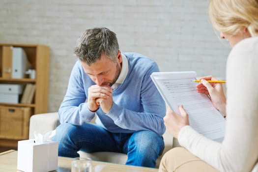Tense man visiting his psychologist