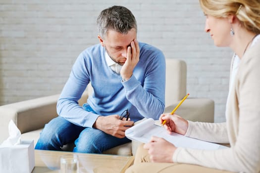 Unhappy patient visiting his psychologist