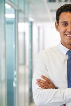 Elegant businessman with crossed arms looking at camera