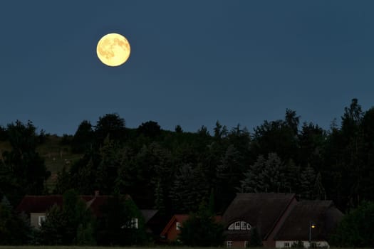 Full moon in the night sky over Alt Reddevitz/Mönchgut,island of Rügen