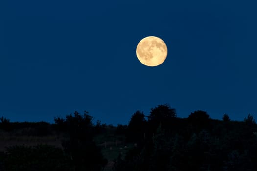 Full moon in the night sky over Alt Reddevitz/Mönchgut,island of Rügen