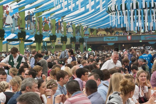 MUNICH, GERMANY – SEPT. 20, 2015: Traditional Marching Bands with Local Costumes entertain Crowds of visitors at the annual Oktoberfest. The Festival runs from September 19th until October 4th 2015 in Munich, Germany