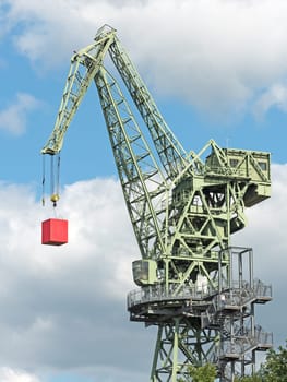 Boom crane with red cube