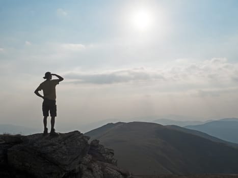 Hiker looks into the mountains