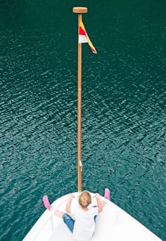 Bug of a ship with child