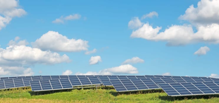 Solar power plant under a blue summer sky