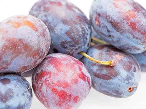 Plums on a white background