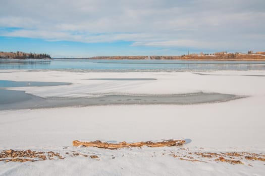 Snowy landscape of the Calgary Glenmore Reservoir in winter.