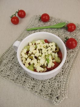 Cups crumble with tomato,cucumber,olive and feta crumbles from the microwave