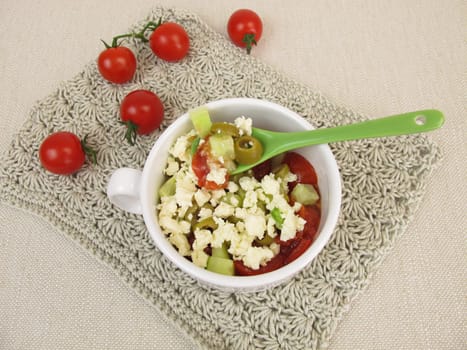 Cups crumble with tomato,cucumber,olive and feta crumbles from the microwave