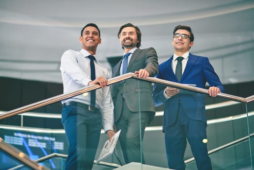 Group of elegant businessmen gathered at meeting