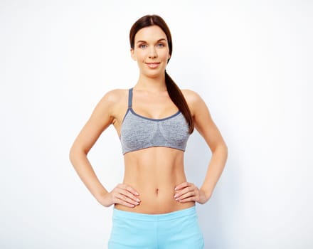 Fit woman in activewear looking at camera