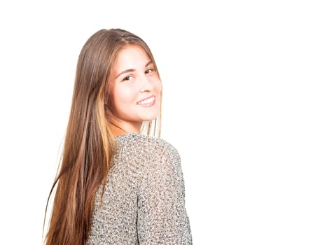attractive young woman looks over her shoulder