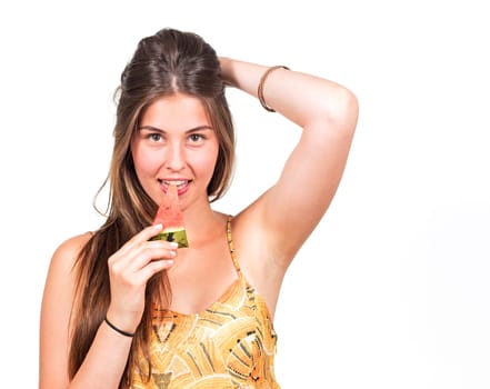 attractive young woman eats a piece of melon