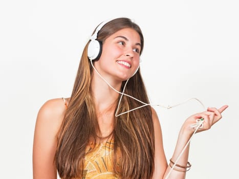 attractive young woman dances with headphones
