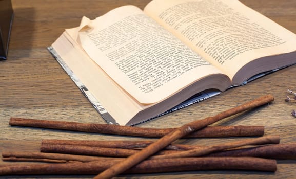 Close up of open book on wooden table