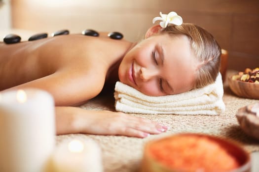 Peaceful woman enjoying spa procedure