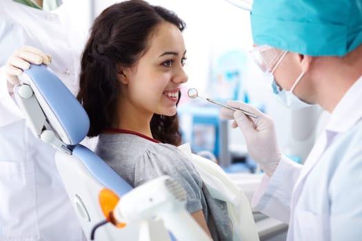 Cute female patient having dental check-up
