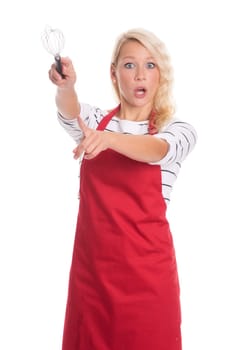 Woman in apron points to something with a whisp and is stressed