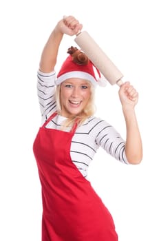 Woman with Christmas hat and apron holds a rolling pin