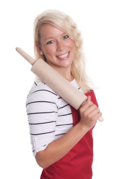 Housewife in kitchen apron holds a dough roll