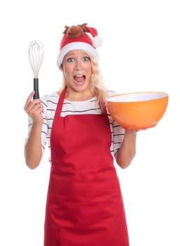 Excited Christmas woman in apron holds a bowl and a quirl