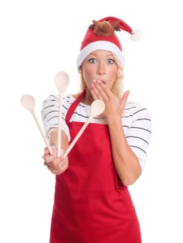 Stressed Christmas woman with cooking spoons