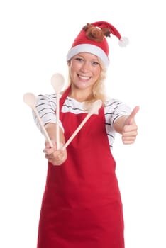 Christmas woman with kitchen apron shows three cooking spoons