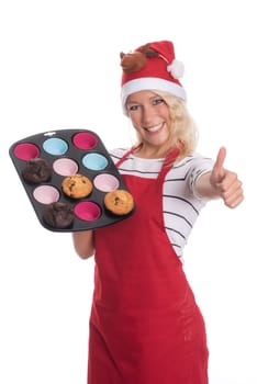 Woman with Christmas hat offers homemade muffins
