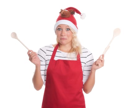 Christmas woman with cooking spoons looks skeptical