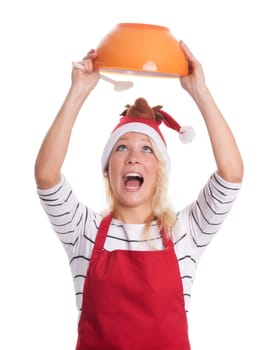Christmas woman with apron looks into a bowl and screams
