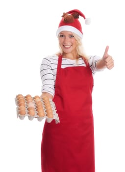 Woman with Christmas hat and apron holds a palette of eggs