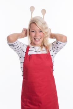 Housewife keeps cooking spoon behind her head