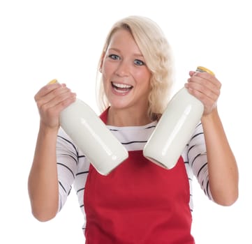 Housewife in red apron holds two bottles of milk