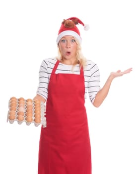 Christmas woman with apron holds eggs on a cardboard