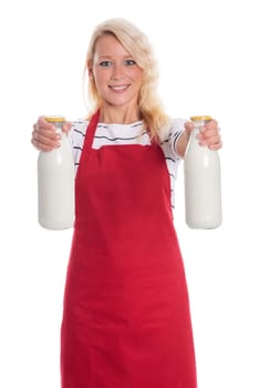 Housewife in red apron holds two bottles of milk