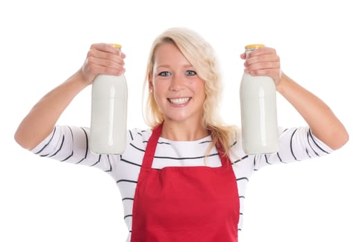 Housewife in red apron holds two bottles of milk