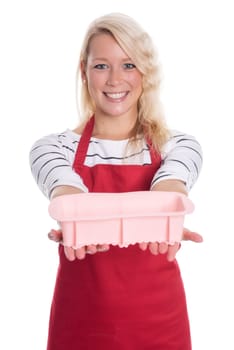Woman in apron holds a silicone baking dish