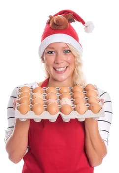 Woman with Christmas hat and apron holds a palette of eggs