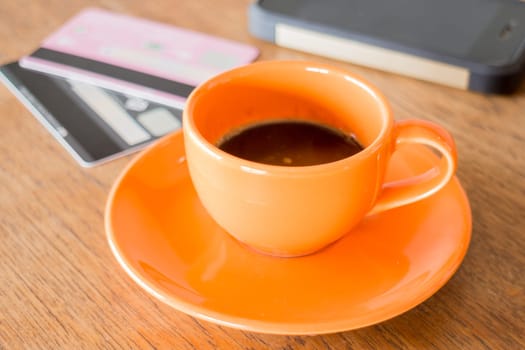 Hot coffee cup on wooden table, stock photo