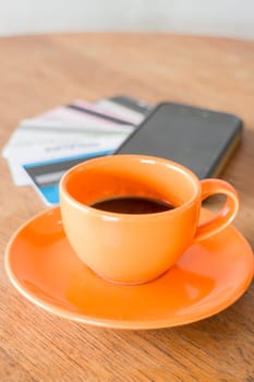 Hot coffee cup on wooden table, stock photo