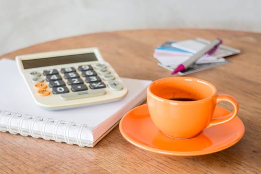 Hot coffee cup on wooden table, stock photo