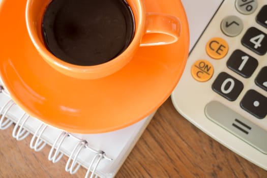 Hot coffee cup on wooden table, stock photo