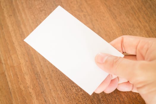 Hand holding a business card, stock photo