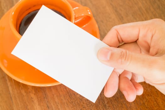 Hand holding a business card, stock photo