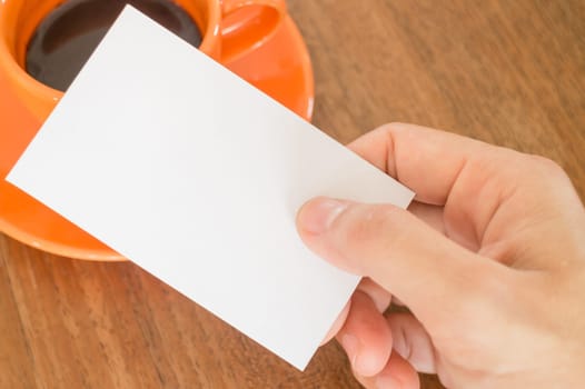 Hand holding a business card, stock photo