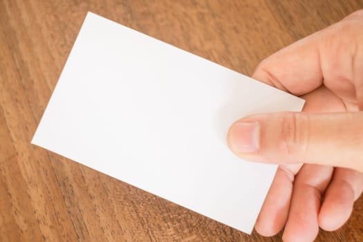 Hand holding a business card, stock photo