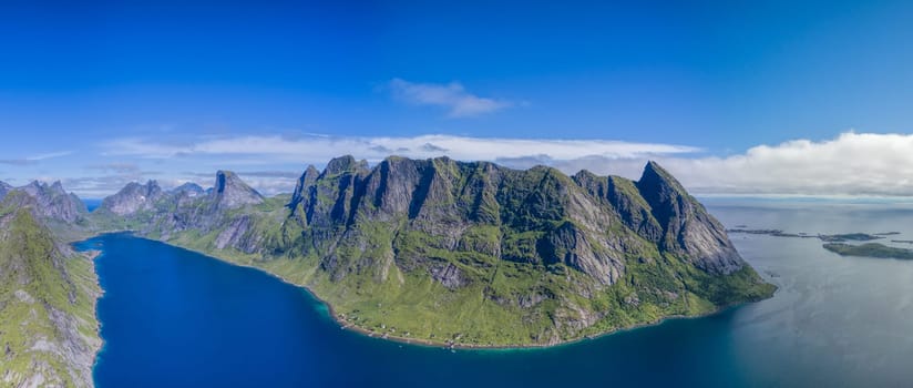 Reinefjorden, beautiful fjord on Lofoten islands in Norway surrounded by magnificent peaks