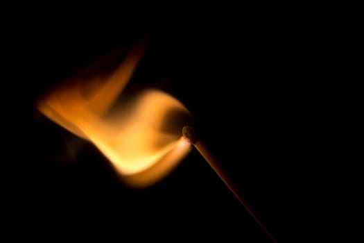 Match Igniting in a burst of fire. Macro Image.