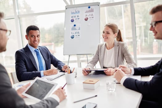 Happy employees listening to their colleague explanation